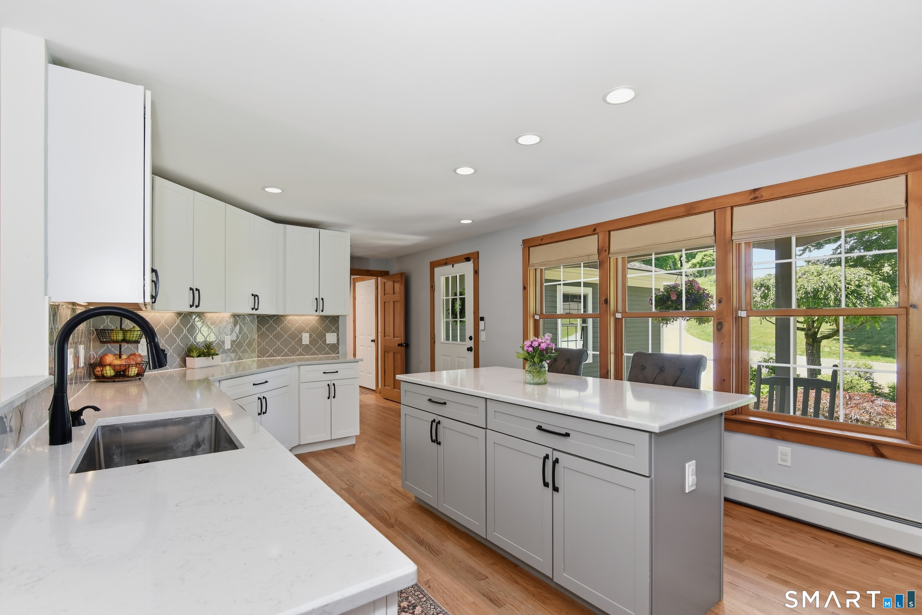 80 West Quasset Road Woodstock, CT 06281 - Photo 5 of 38 Large triple windows provide natural light for the kitchen.