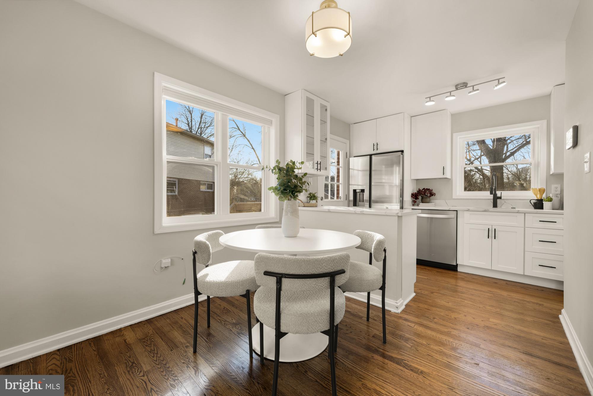 6112 Paulonia Road Alexandria, VA 22310 - Photo 11 of 48 a view of a dining room with furniture and wooden floor