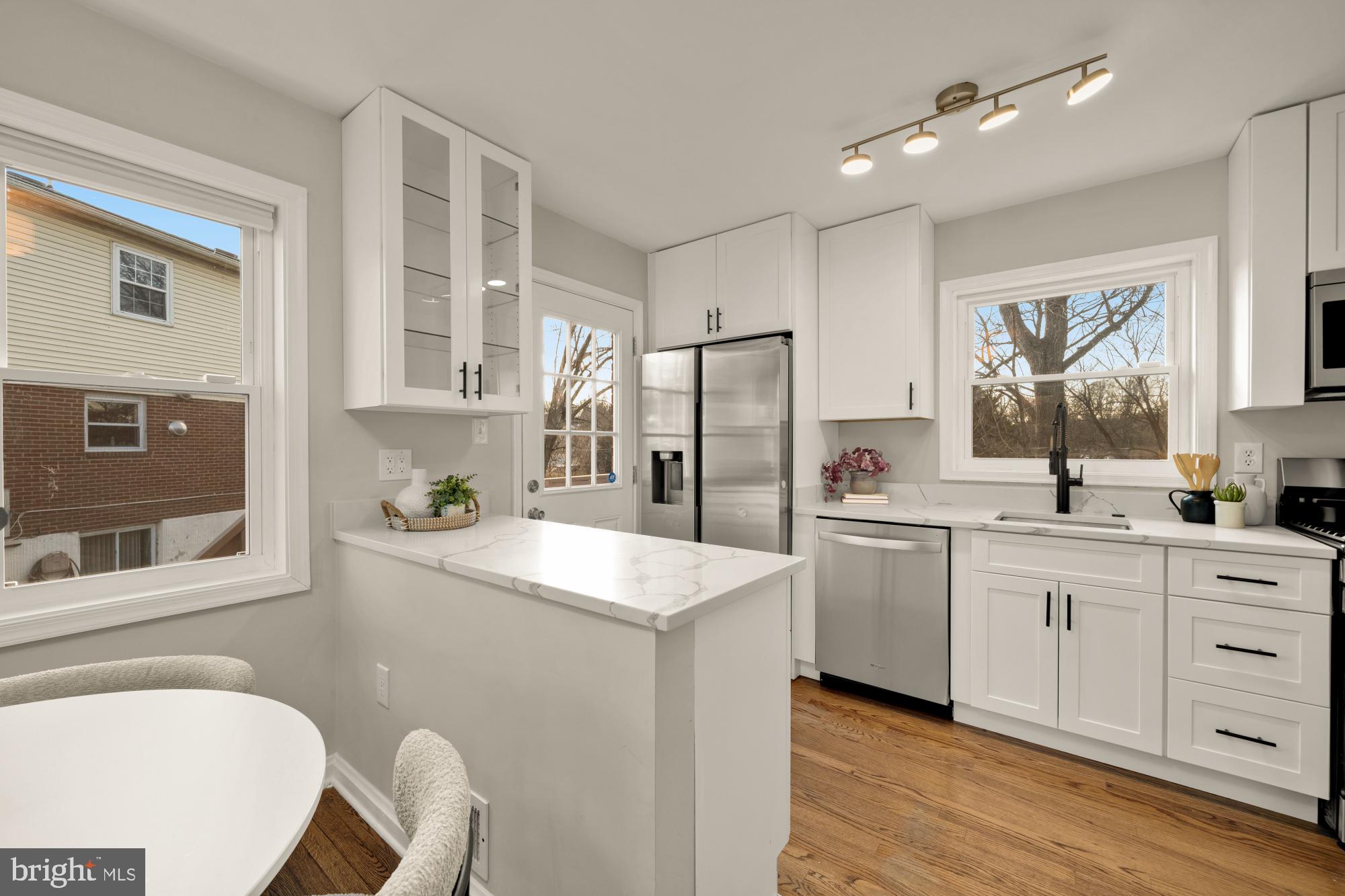 6112 Paulonia Road Alexandria, VA 22310 - Photo 13 of 48 a kitchen with white cabinets and sink