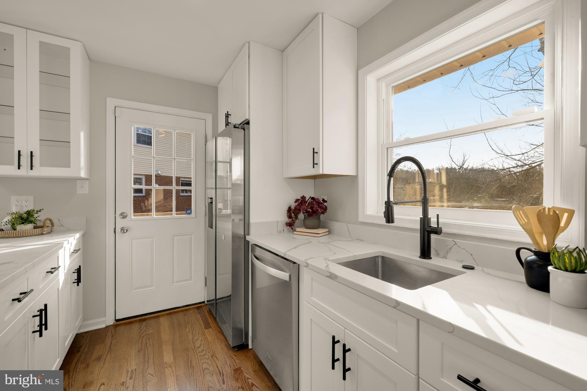 6112 Paulonia Road Alexandria, VA 22310 - Photo 19 of 48 a kitchen with a sink a counter and appliances