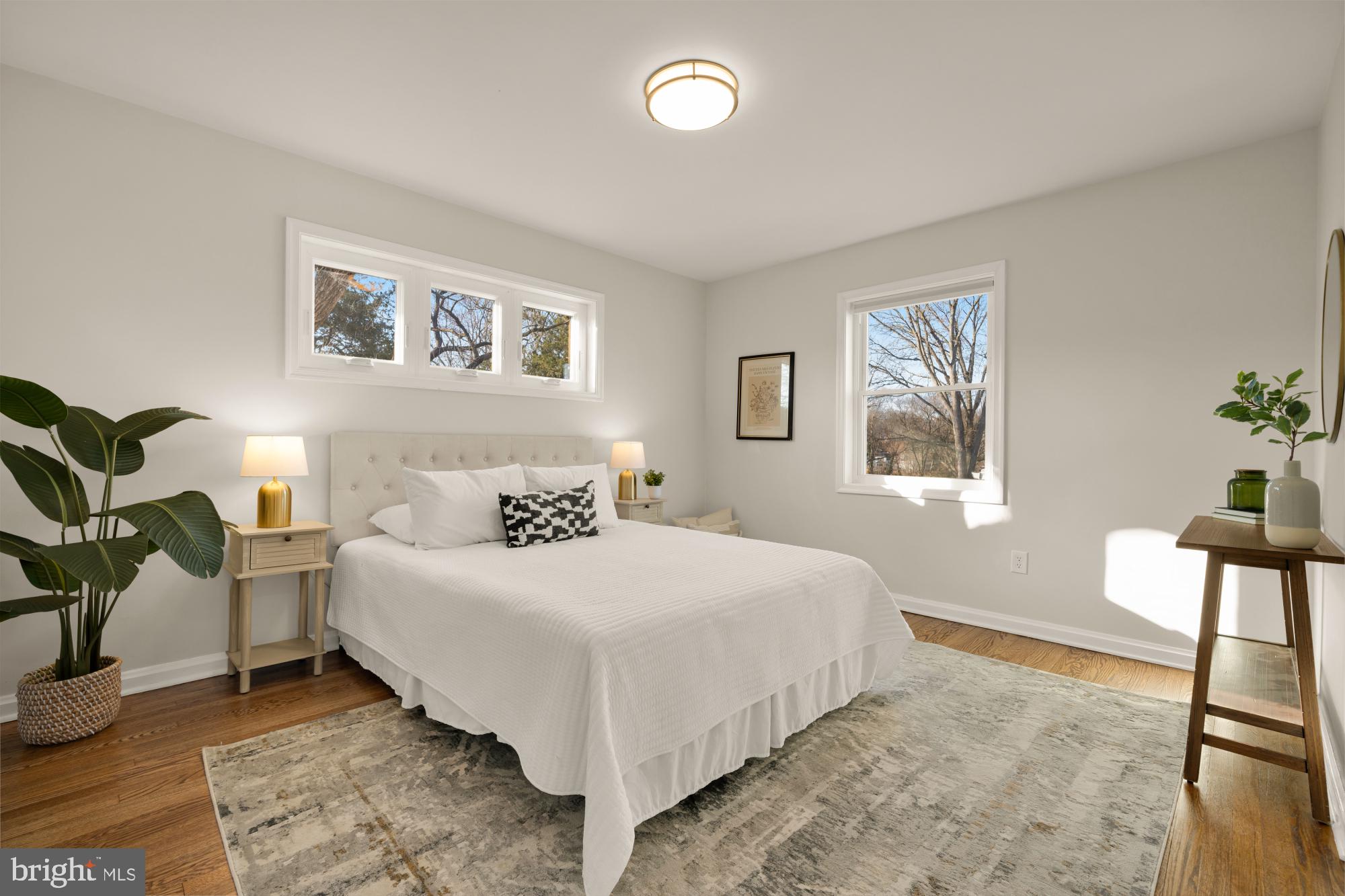 6112 Paulonia Road Alexandria, VA 22310 - Photo 22 of 48 a bedroom with a bed and wooden floor