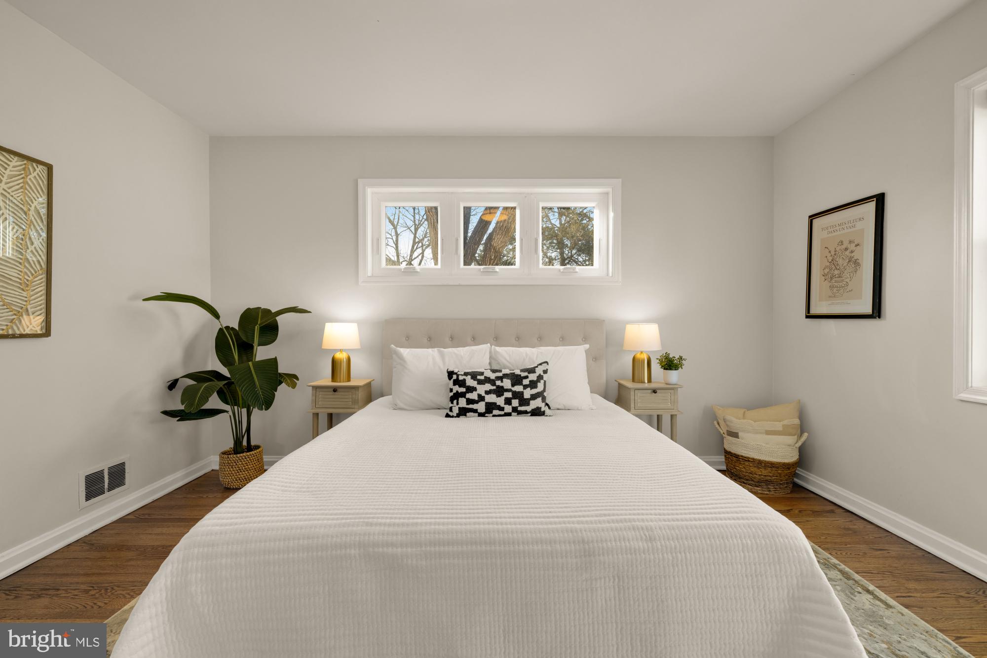 6112 Paulonia Road Alexandria, VA 22310 - Photo 23 of 48 a bedroom with a bed and a painting on the wall