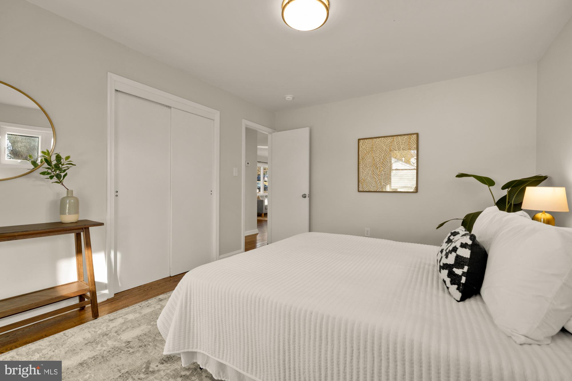 6112 Paulonia Road Alexandria, VA 22310 - Photo 25 of 48 a bedroom with a bed and a potted plant