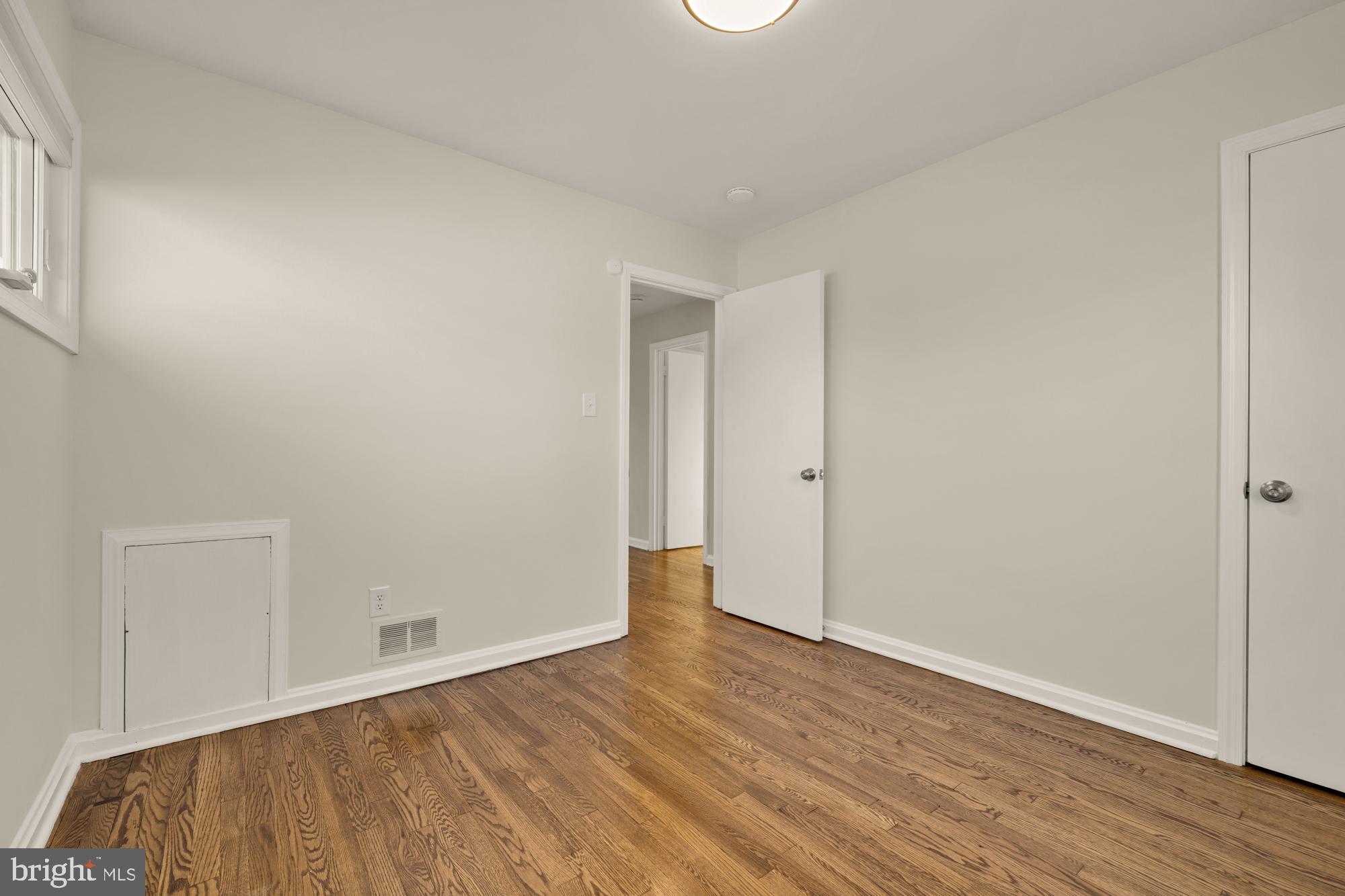 6112 Paulonia Road Alexandria, VA 22310 - Photo 27 of 48 a view of an empty room with wooden floor