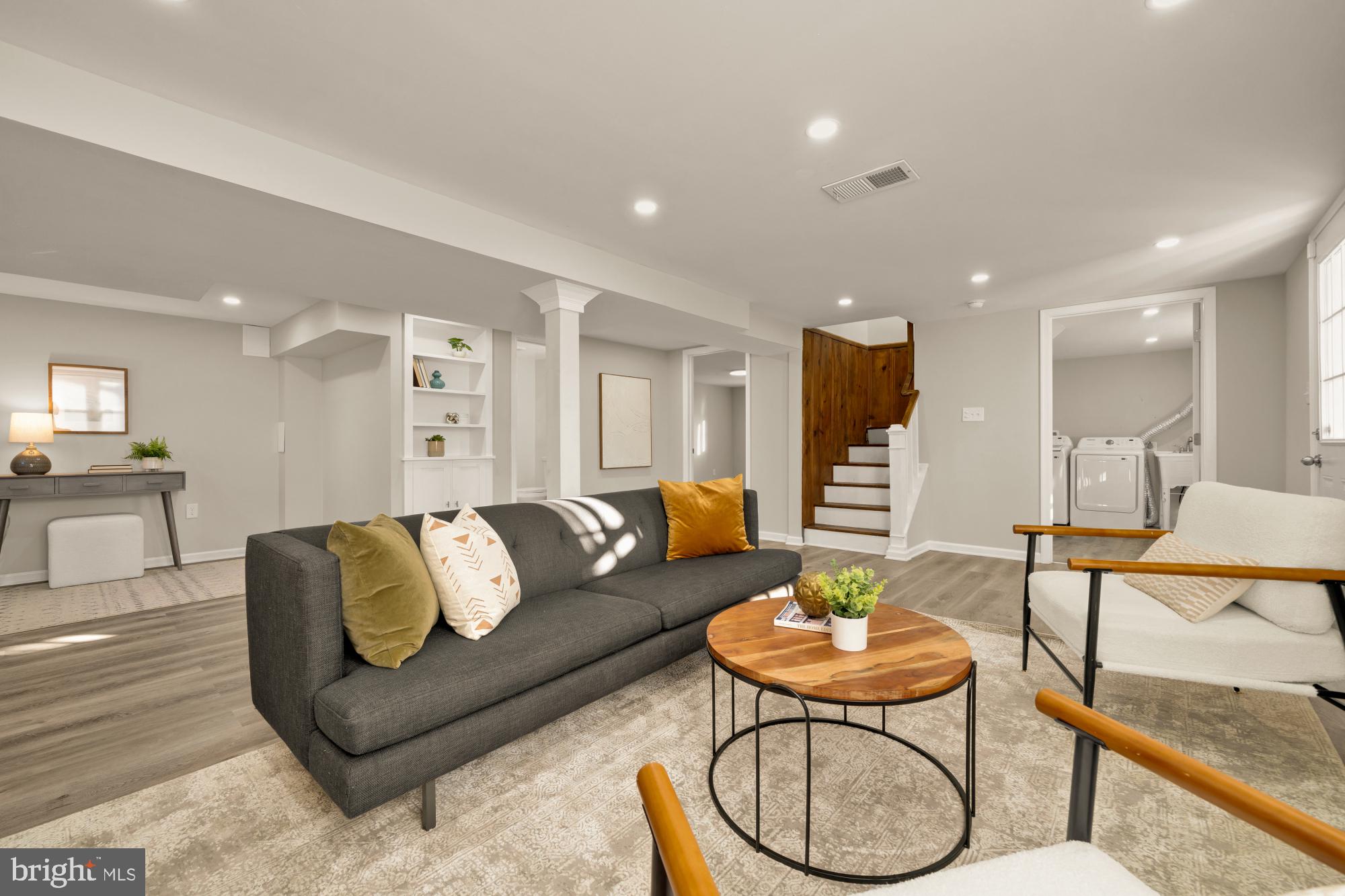 6112 Paulonia Road Alexandria, VA 22310 - Photo 33 of 48 a living room with furniture kitchen and a table