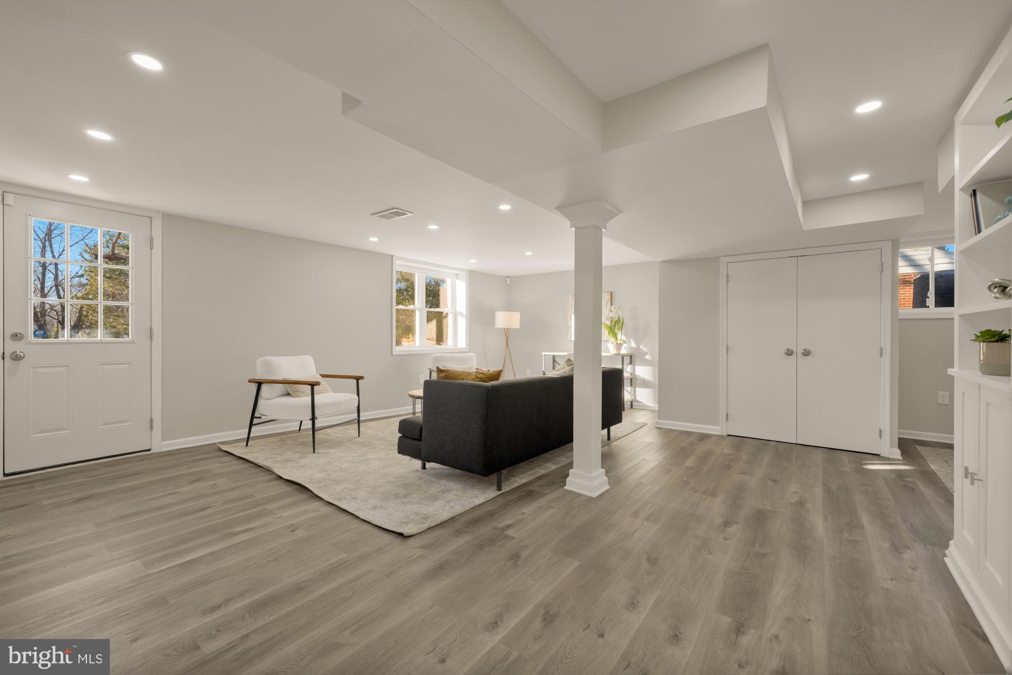 6112 Paulonia Road Alexandria, VA 22310 - Photo 35 of 48 a living room with furniture and a wooden floor