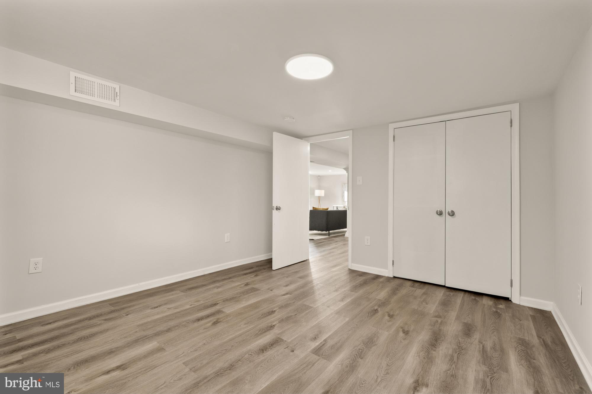 6112 Paulonia Road Alexandria, VA 22310 - Photo 37 of 48 a view of an empty room with wooden floor