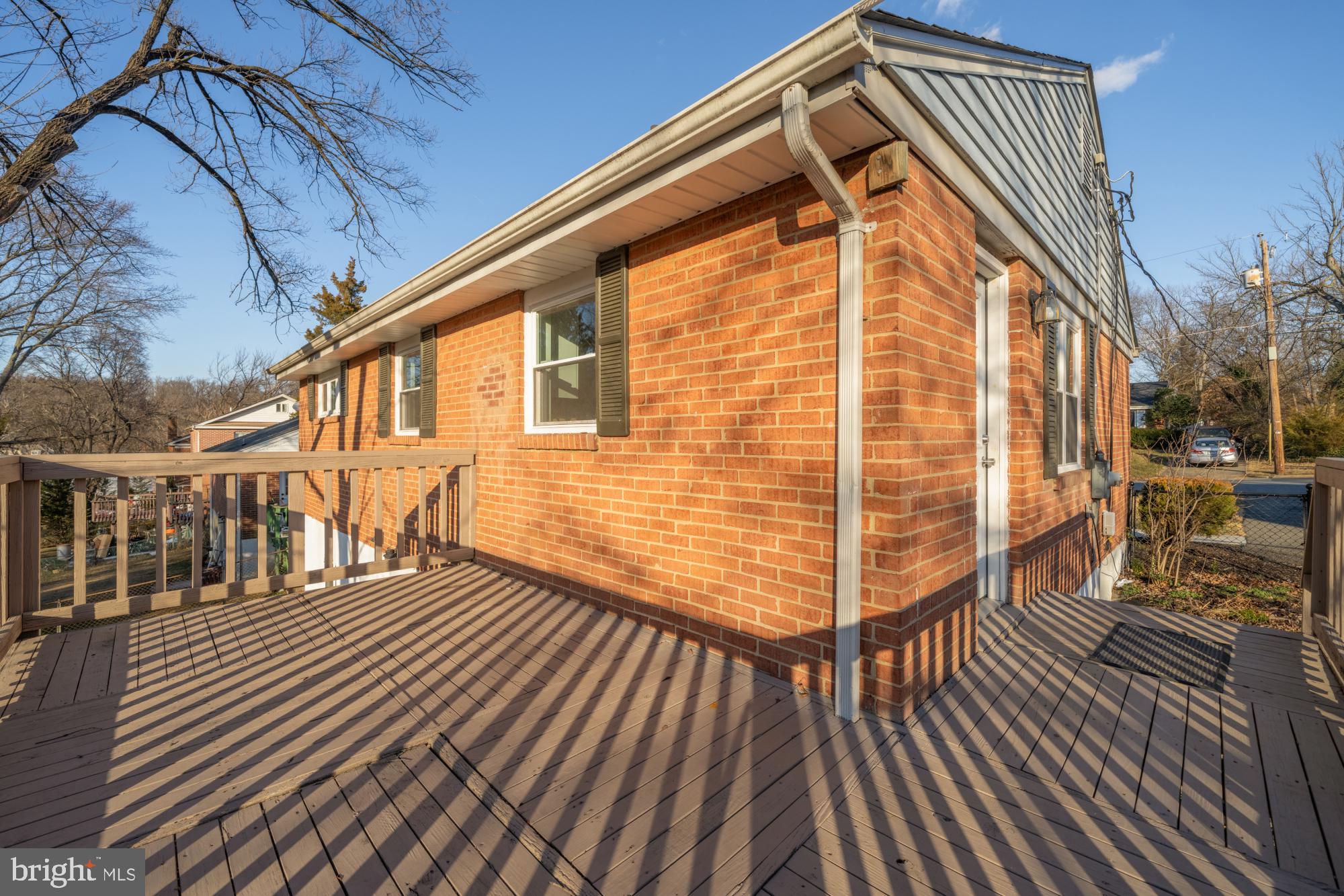 6112 Paulonia Road Alexandria, VA 22310 - Photo 44 of 48 a view of a house with a wooden deck