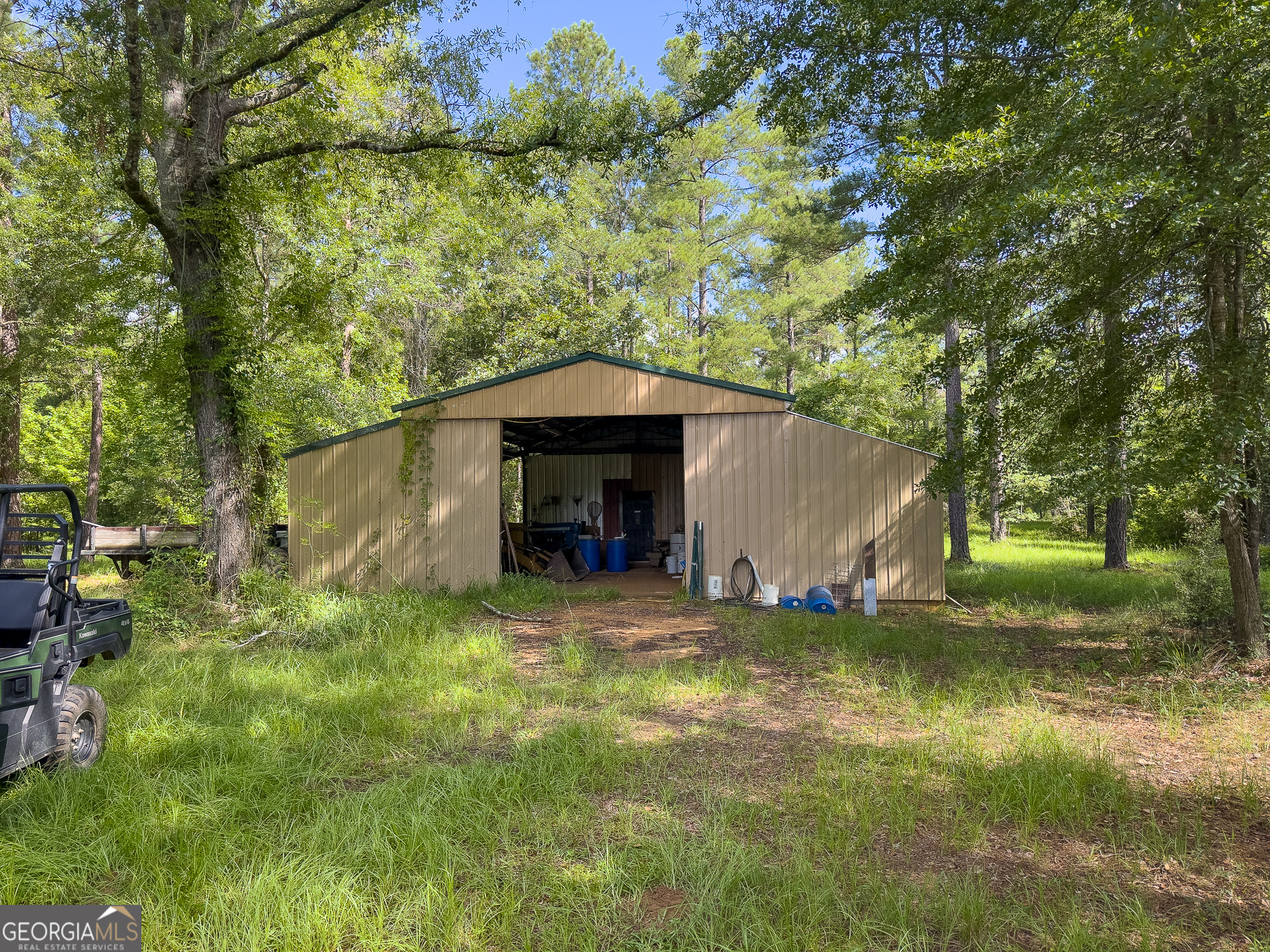 583 Treisch Road Pineview, GA 31071 - Photo 27 of 53 a view of a house with a yard garage and a tree