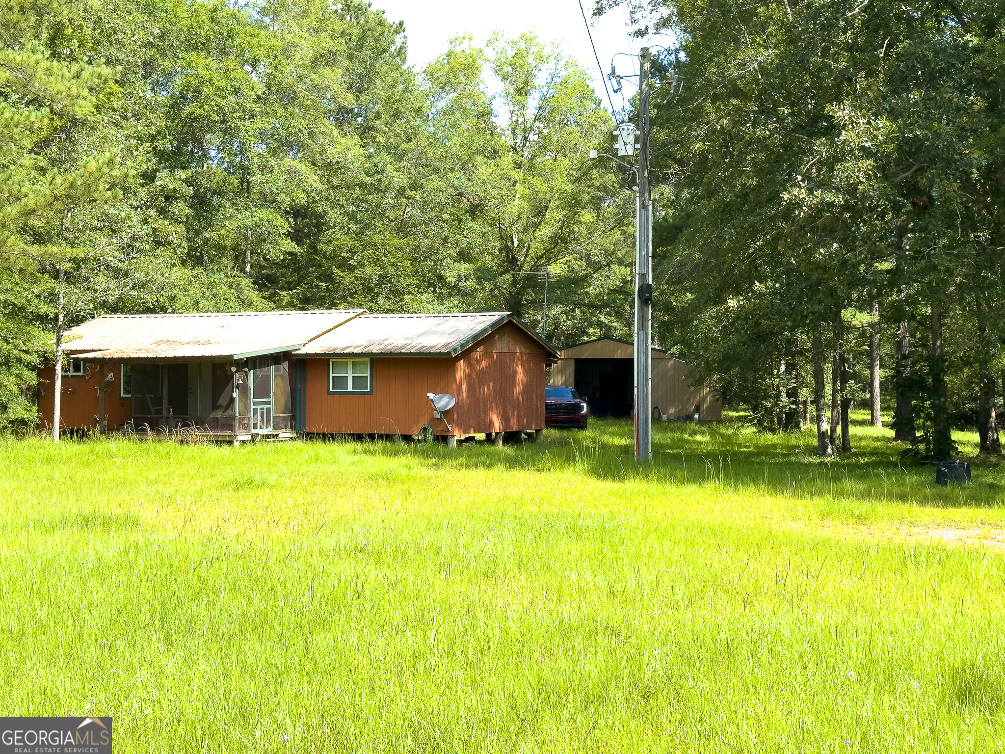583 Treisch Road Pineview, GA 31071 - Photo 31 of 53 a view of a house with pool and a yard