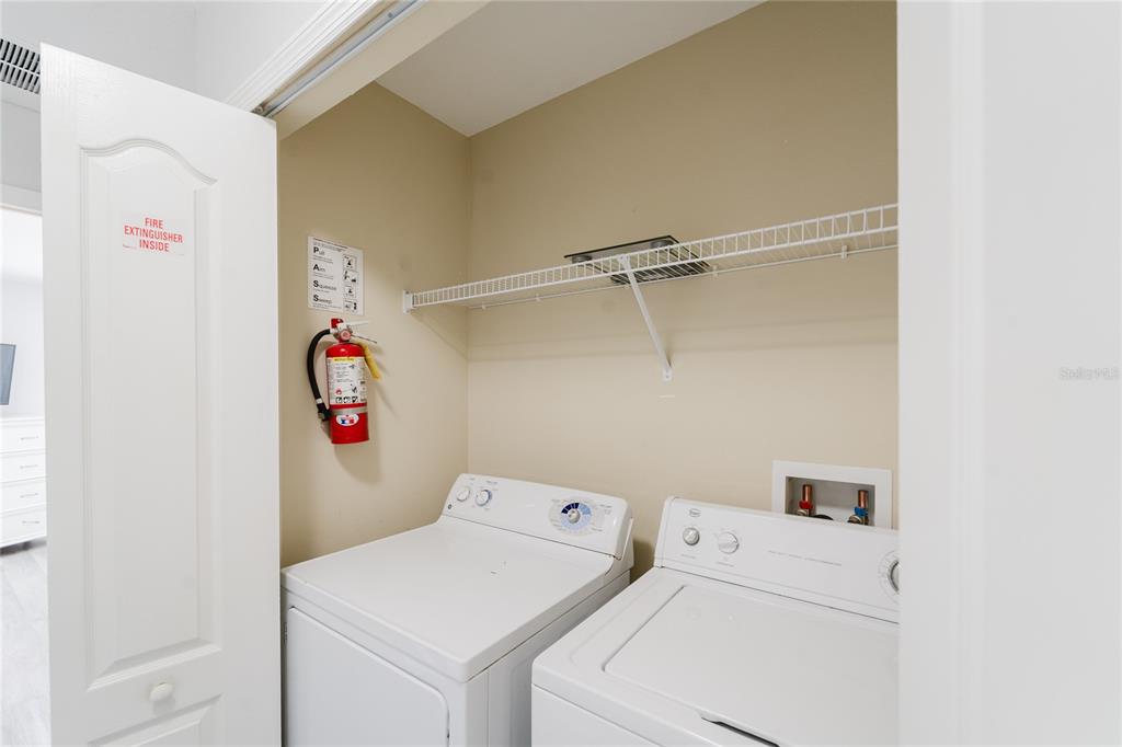 8961 Majesty Palm Road Kissimmee, FL 34747 - Photo 30 of 40 a utility room with dryer and washer