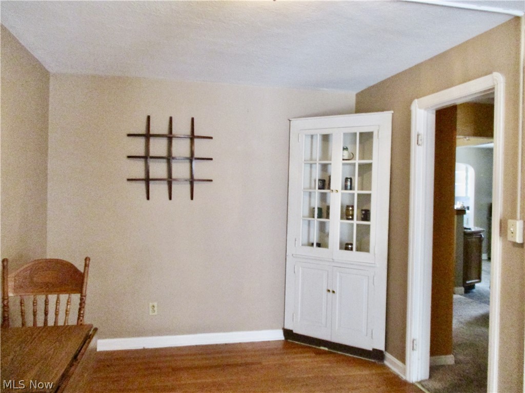 6411 Snow Road Parma, OH 44129 - Photo 7 of 14 Main floor bedroom with hardwood floors, could be used as a dining room