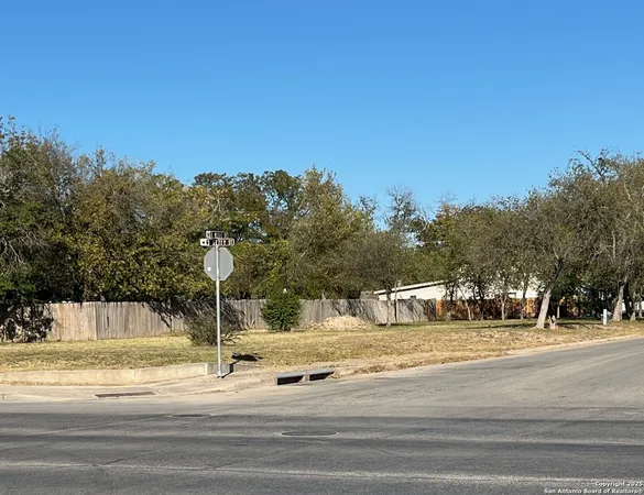 a view of a fountain is middle in the middle of a road