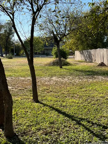 a view of a parking area with parked cars