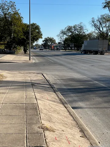 a view of street with parked cars