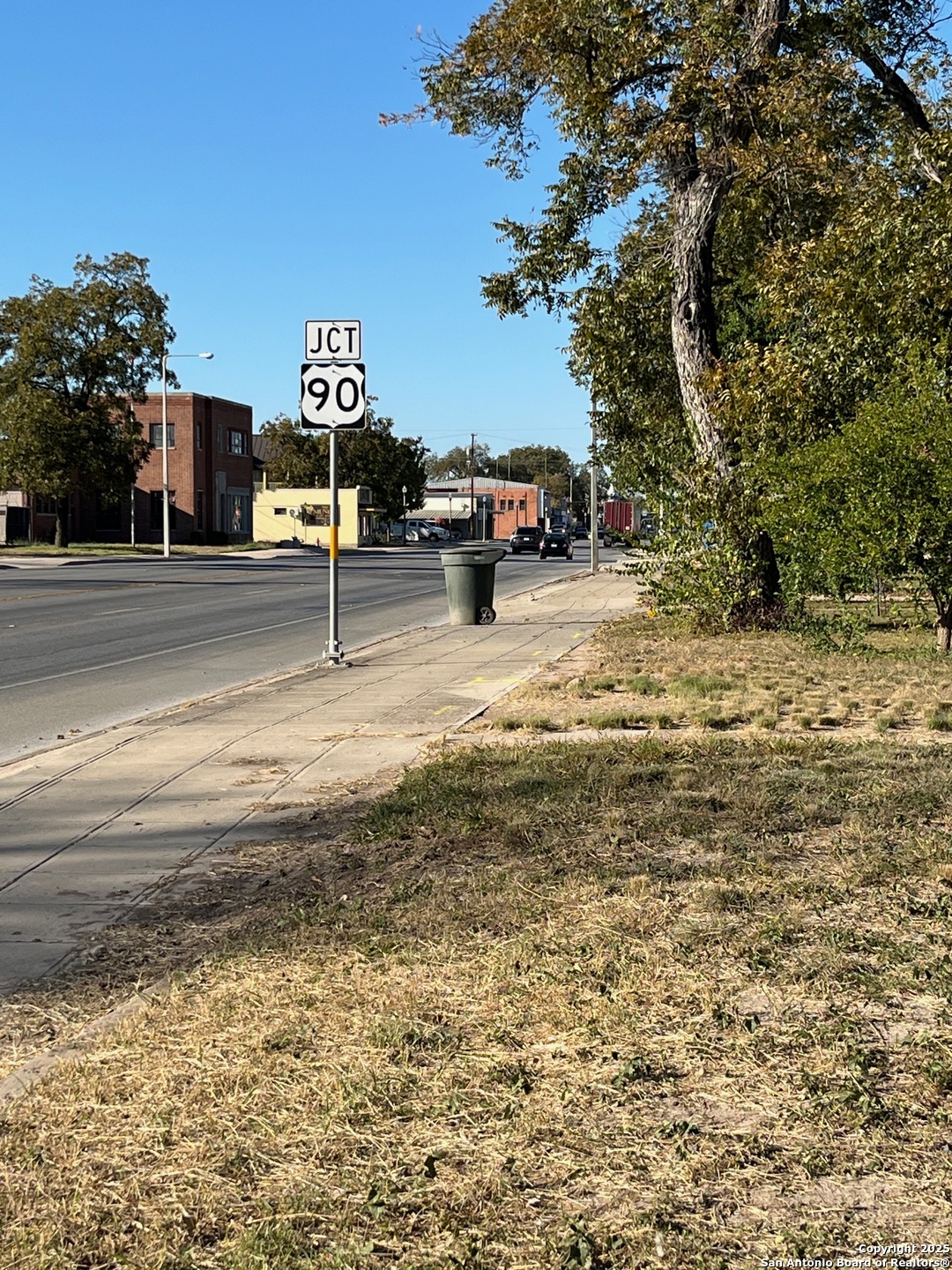 328 South Getty Street Uvalde, TX 78801 - Photo 10 of 12 a view of a parking area with parked cars