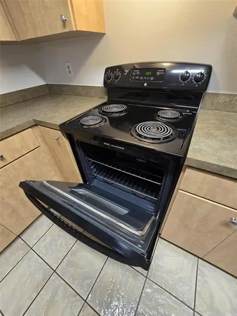 a kitchen with stainless steel appliances granite countertop a refrigerator sink and cabinets