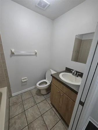 a bathroom with a toilet and a sink