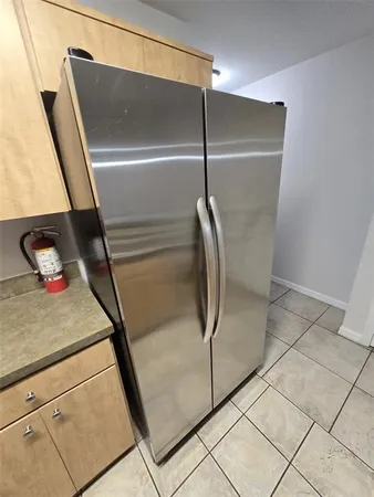 a stove top oven sitting inside of a kitchen