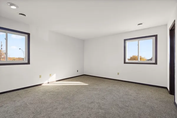 an empty room with windows