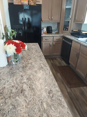 a kitchen that has a sink and cabinets