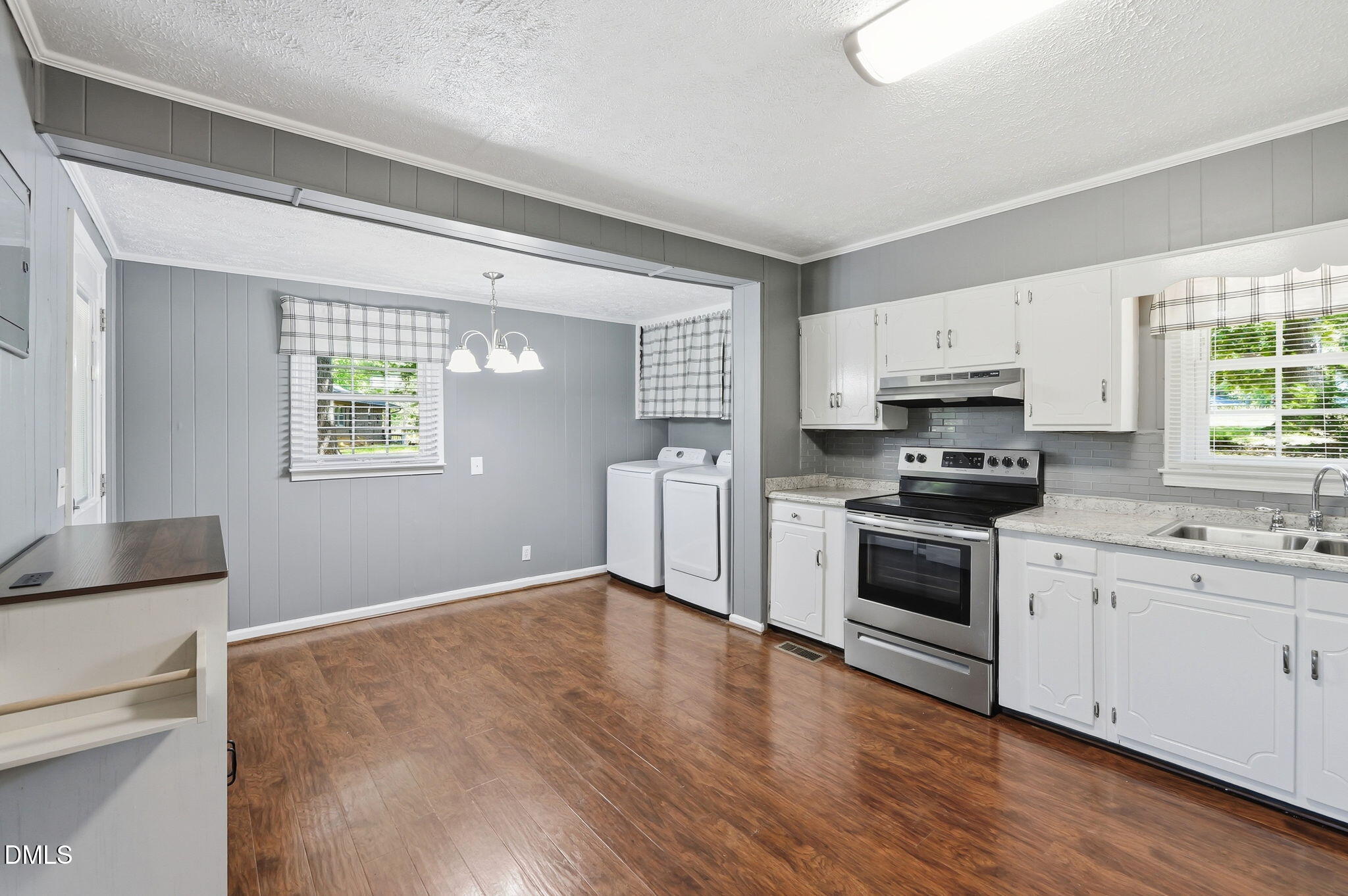 265 Shady Hill Circle Roxboro, NC 27573 - Photo 7 of 18 a kitchen with granite countertop a stove a sink and a refrigerator