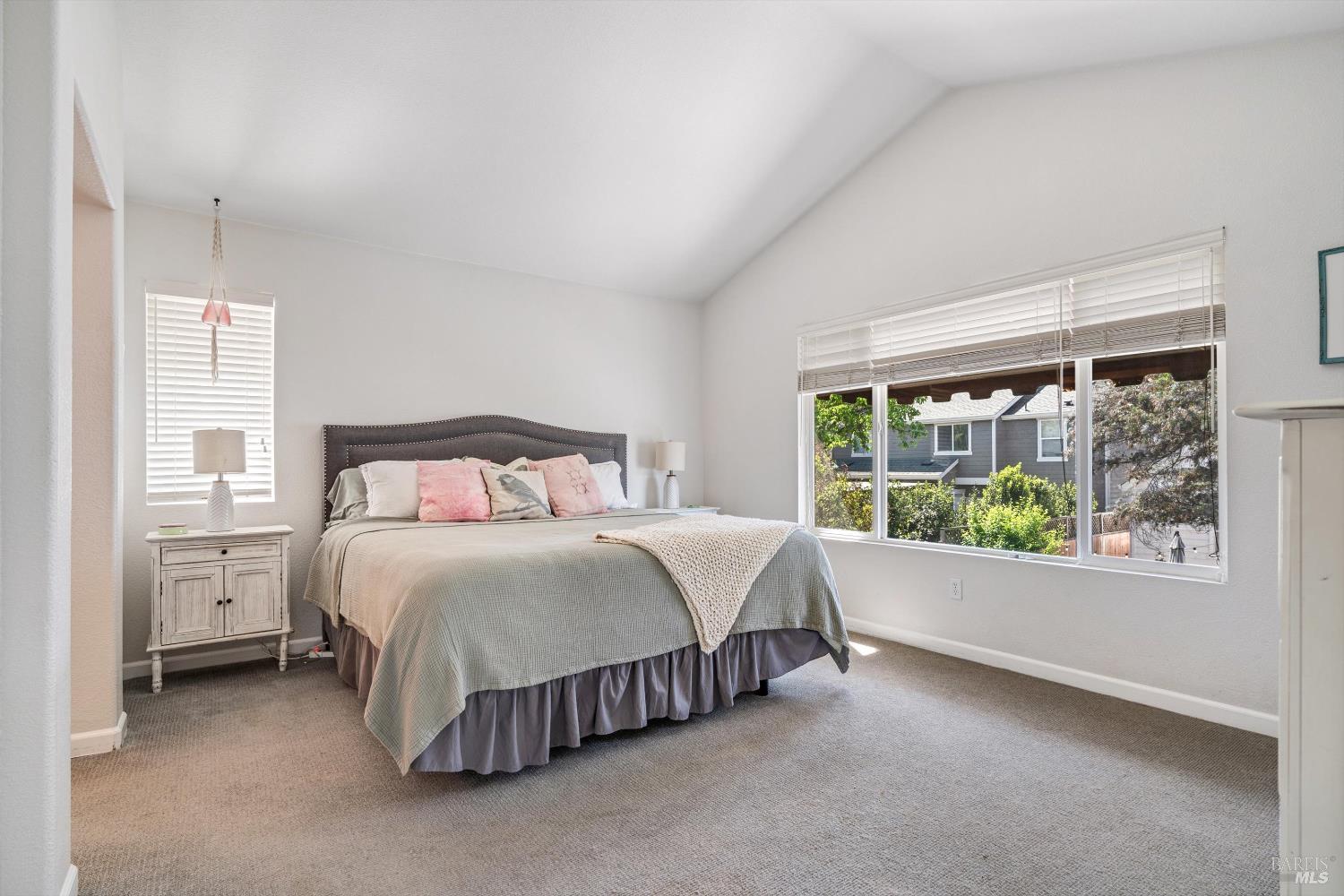 1703 Spur Ridge Lane Healdsburg, CA 95448 - Photo 19 of 28 a bedroom with a bed lamp and window