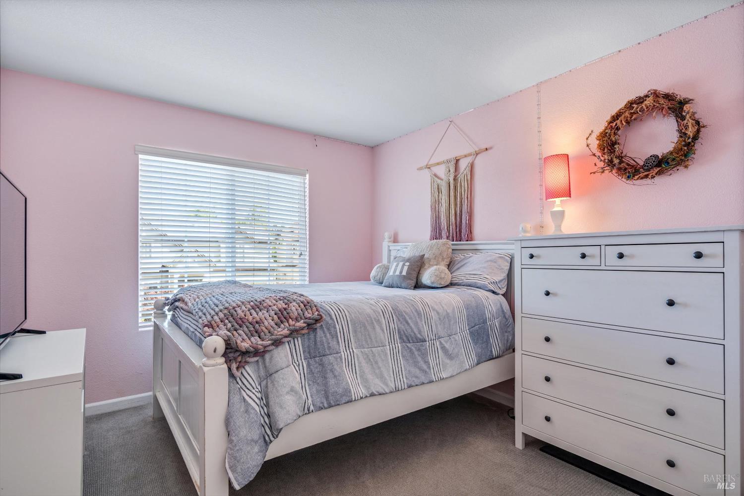 1703 Spur Ridge Lane Healdsburg, CA 95448 - Photo 20 of 28 a bedroom with a bed and a window