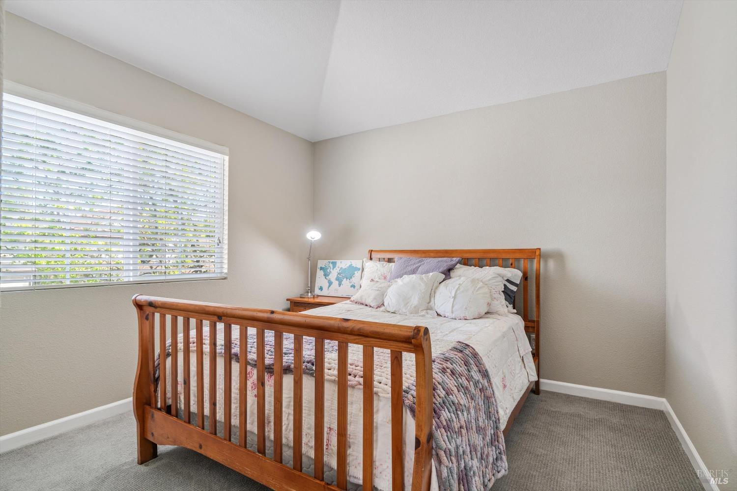 1703 Spur Ridge Lane Healdsburg, CA 95448 - Photo 22 of 28 a bedroom with a bed and a window