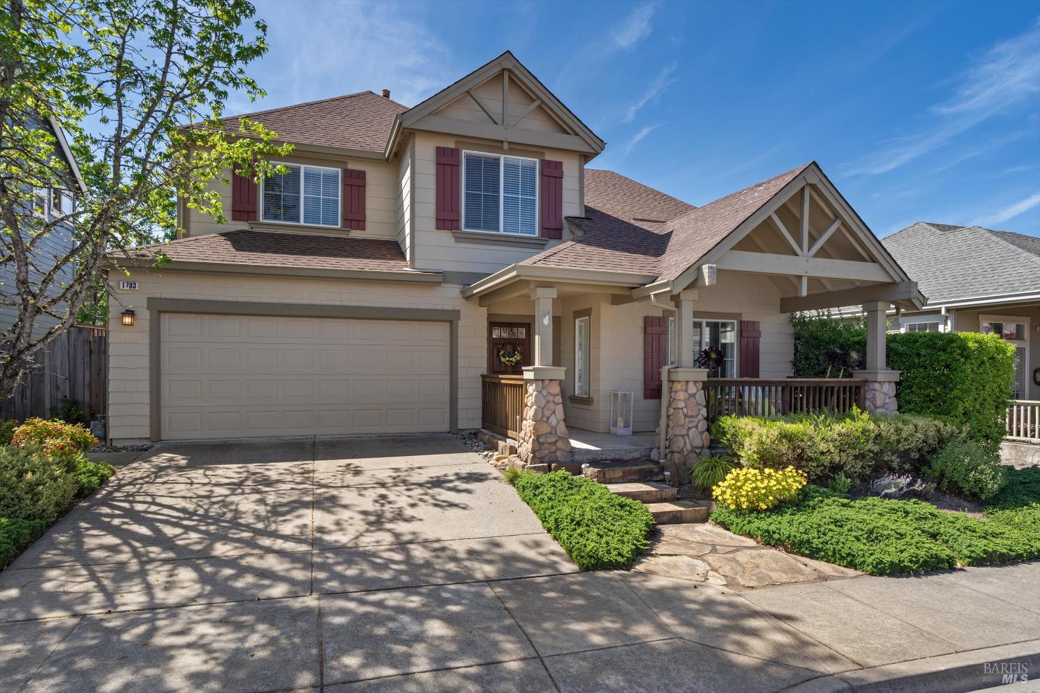 1703 Spur Ridge Lane Healdsburg, CA 95448 - Photo 5 of 28 a front view of a house with a garden