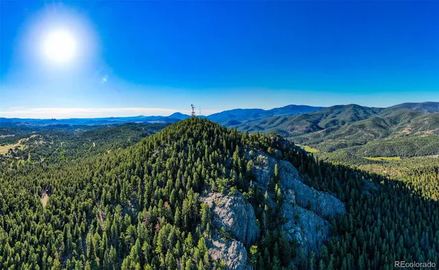 a view of a large yard with an outdoor space