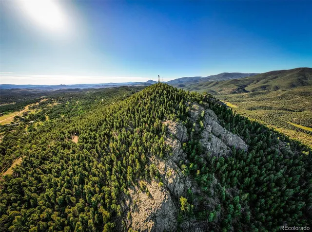 a view of a lush green mountain