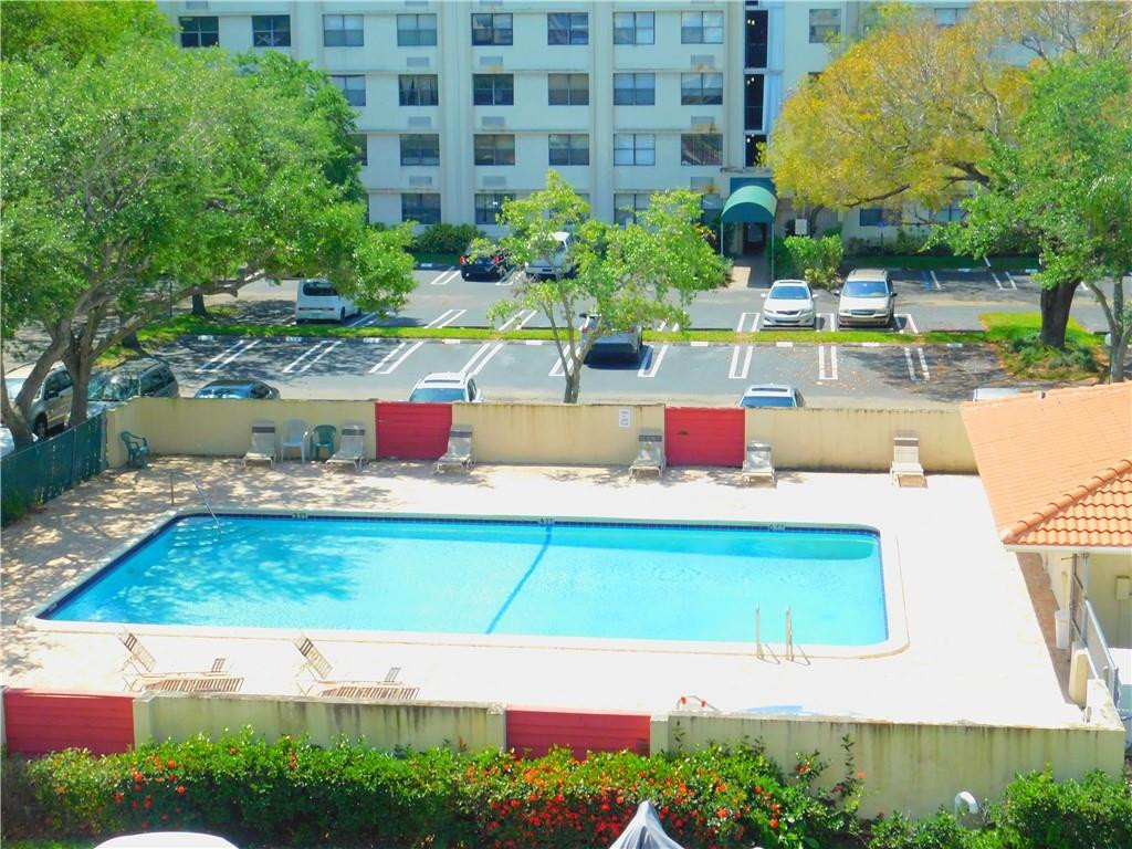 2501 Riverside Drive, Unit 506A Coral Springs, FL 33065 - Photo 11 of 11 a view of swimming pool with sitting area