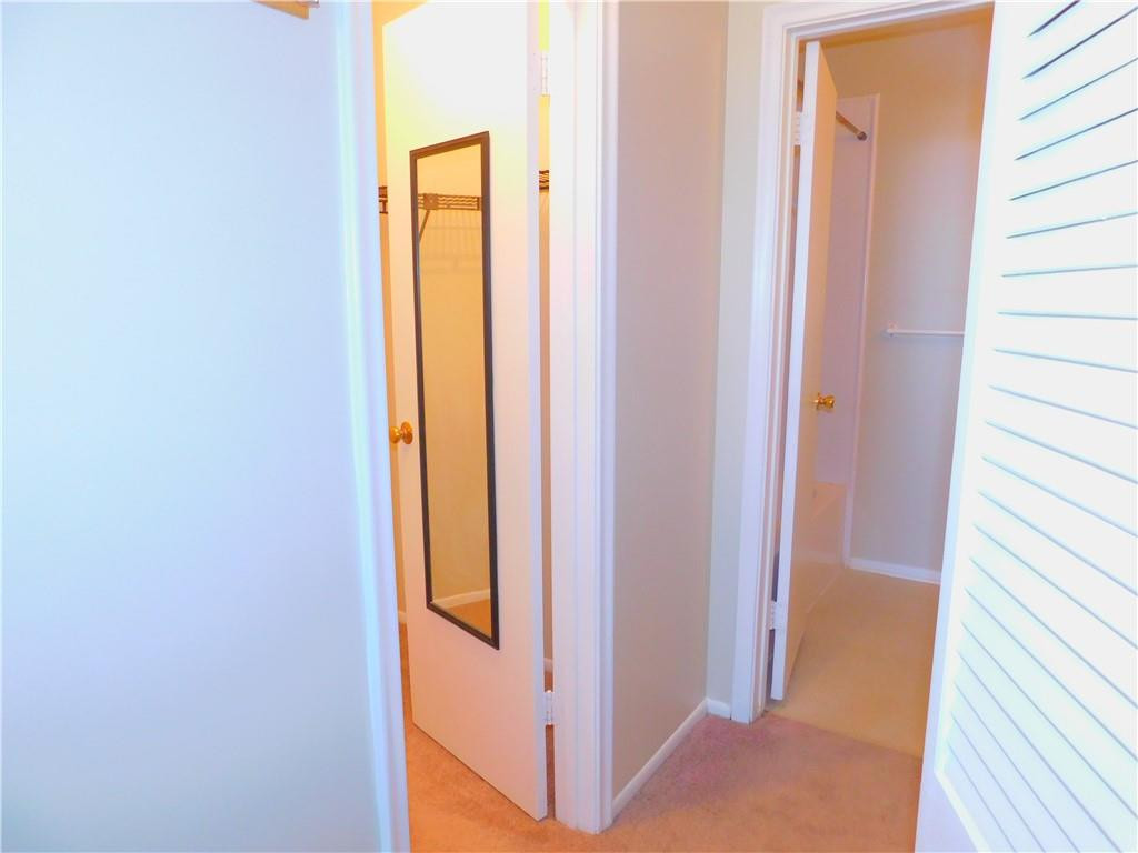 2501 Riverside Drive, Unit 506A Coral Springs, FL 33065 - Photo 8 of 11 a view of a bathroom from a hallway