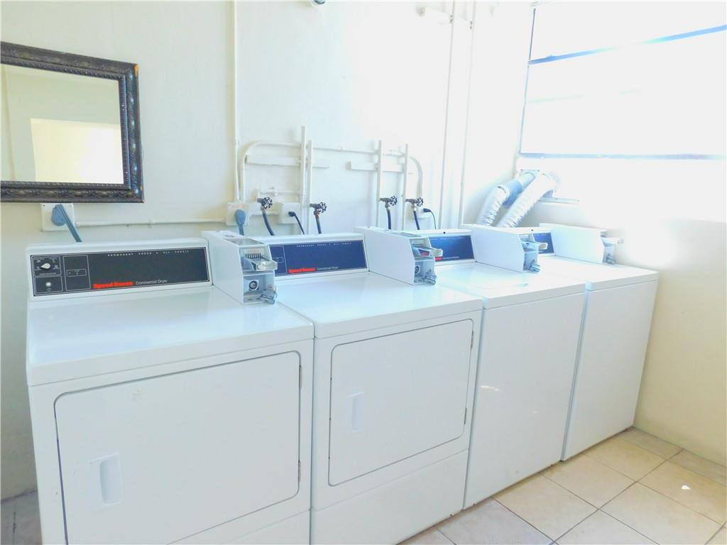 2501 Riverside Drive, Unit 506A Coral Springs, FL 33065 - Photo 10 of 11 a utility room with dryer and washer