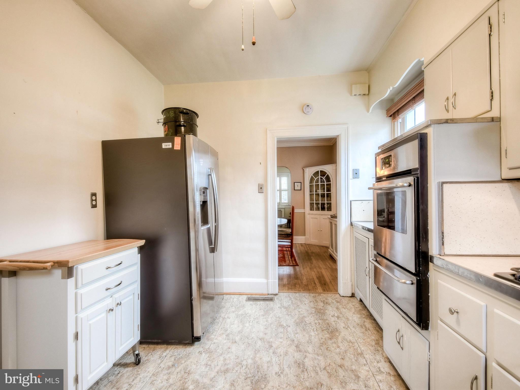 606 Anneslie Road Baltimore, MD 21212 - Photo 8 of 41 a kitchen with stainless steel appliances granite countertop a refrigerator and a stove