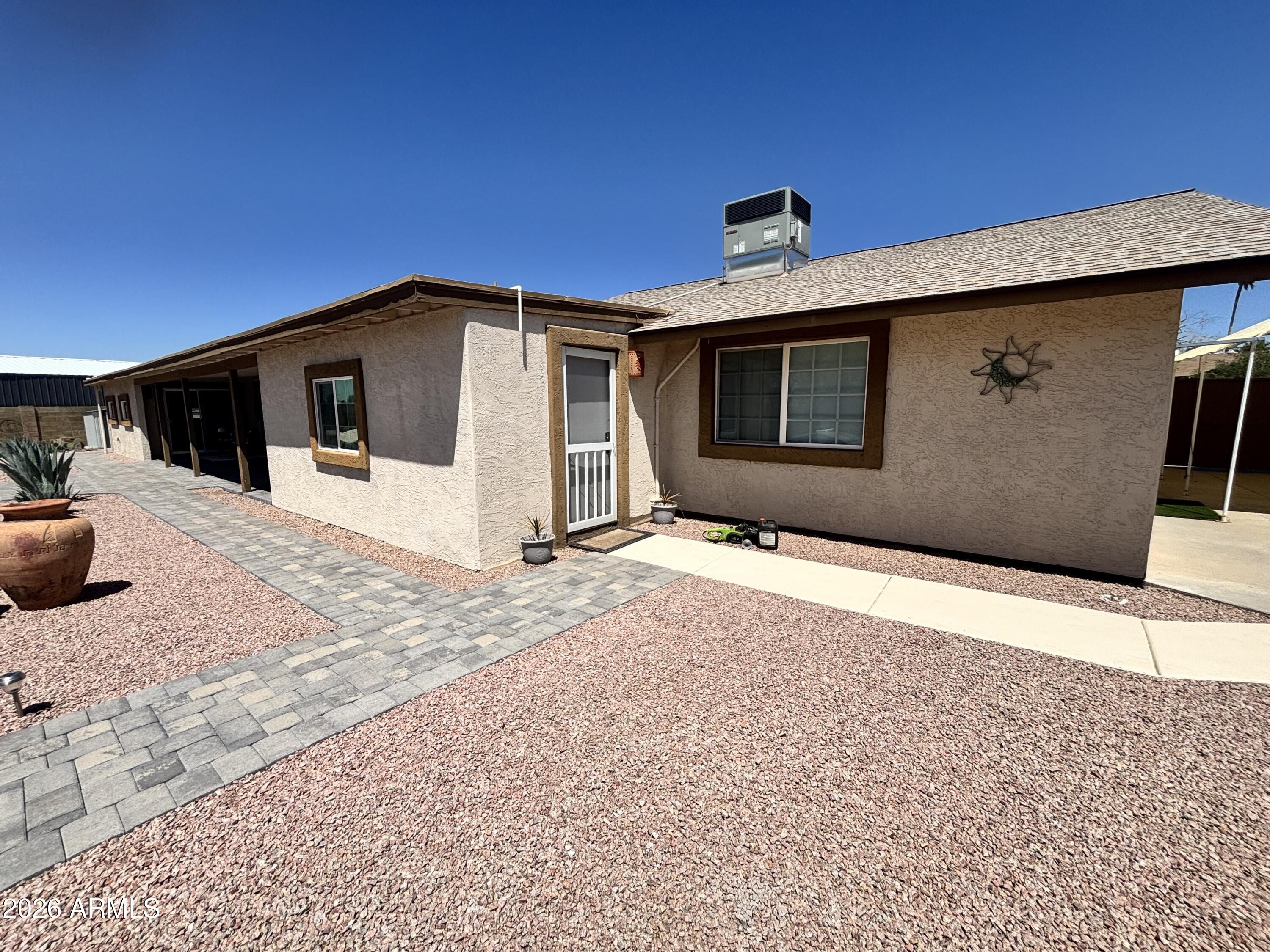 7745 East Mangun Road Mesa, AZ 85207 - Photo 8 of 35 a front view of a house with a yard