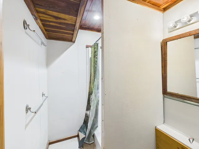 a view of a hallway with paintings on the wall