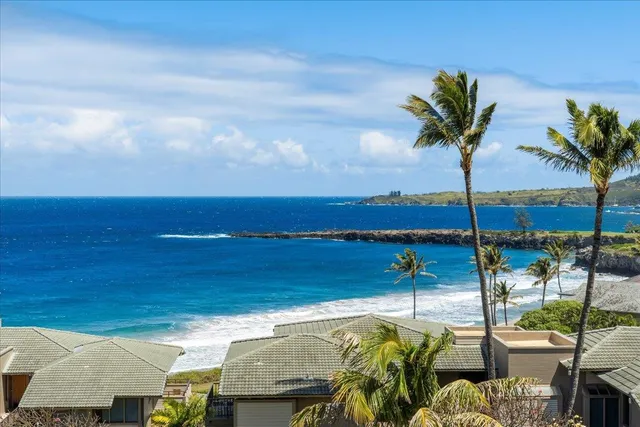 a kitchen with stainless steel appliances granite countertop a sink and a refrigerator