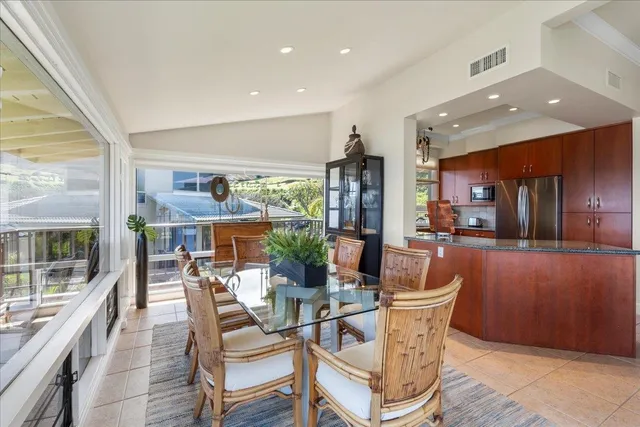 a view of a dining room with furniture window and outside view