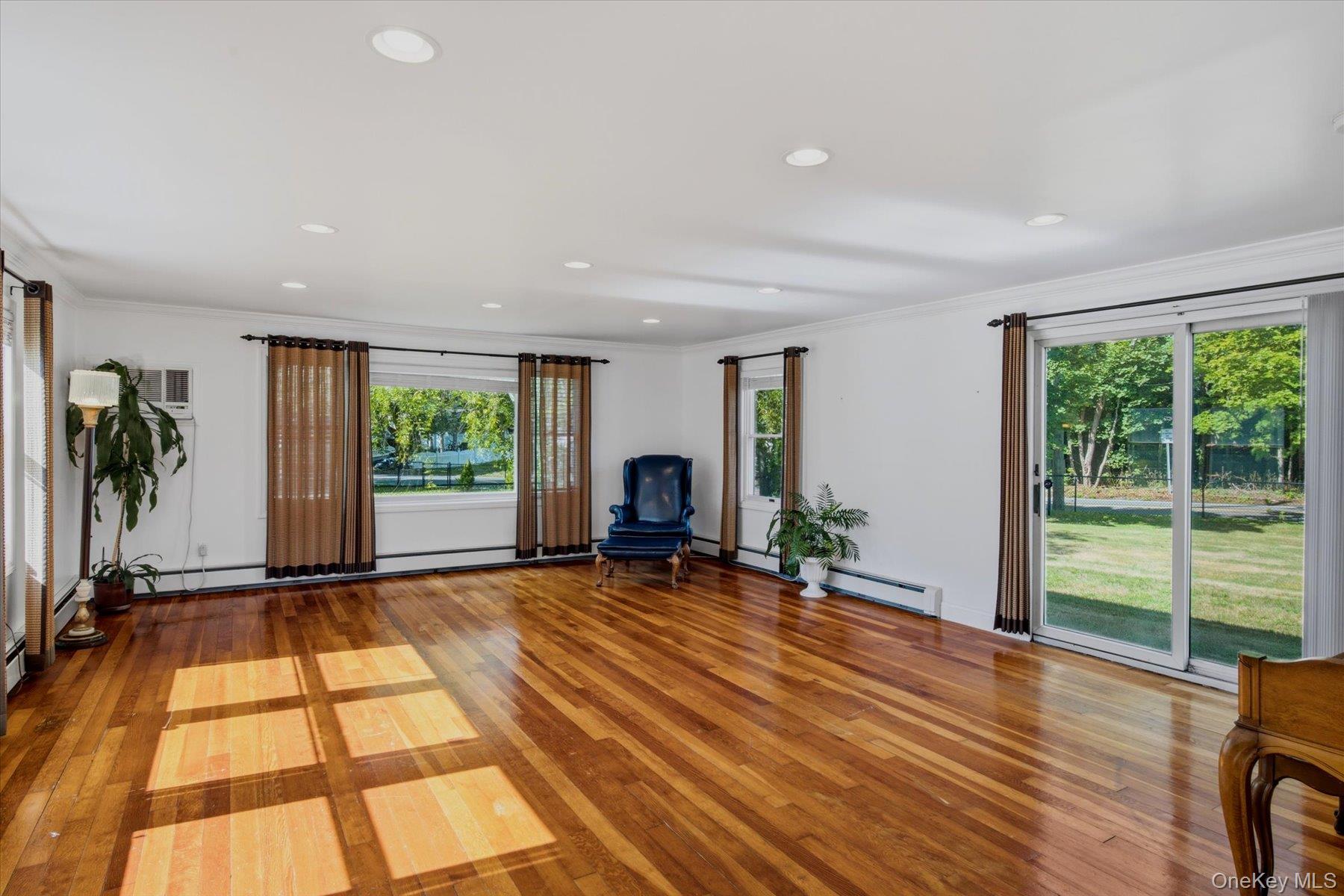 498 Miller Place Road Miller Place, NY 11764 - Photo 7 of 37 Beautiful large family room filled with natural light.