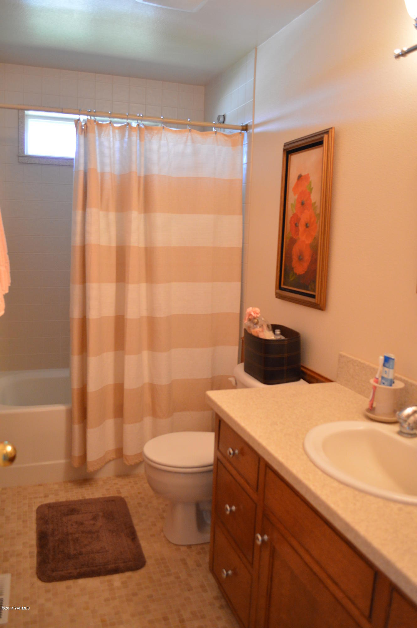 1051 Hubbard Road Yakima, WA 98903 - Photo 20 of 50 a bathroom with a sink a toilet and shower curtain