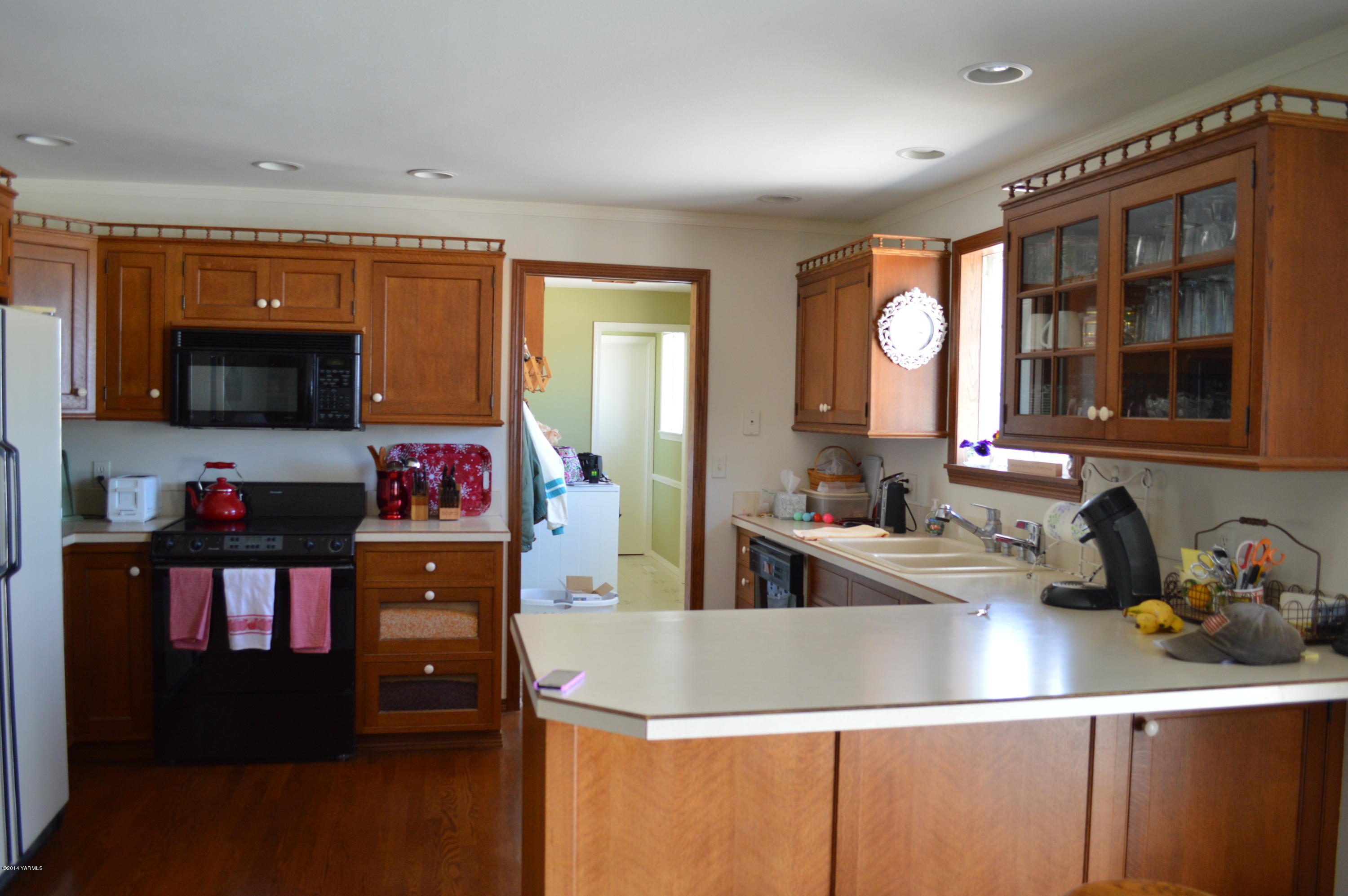 1051 Hubbard Road Yakima, WA 98903 - Photo 8 of 50 a kitchen with sink a microwave and cabinets