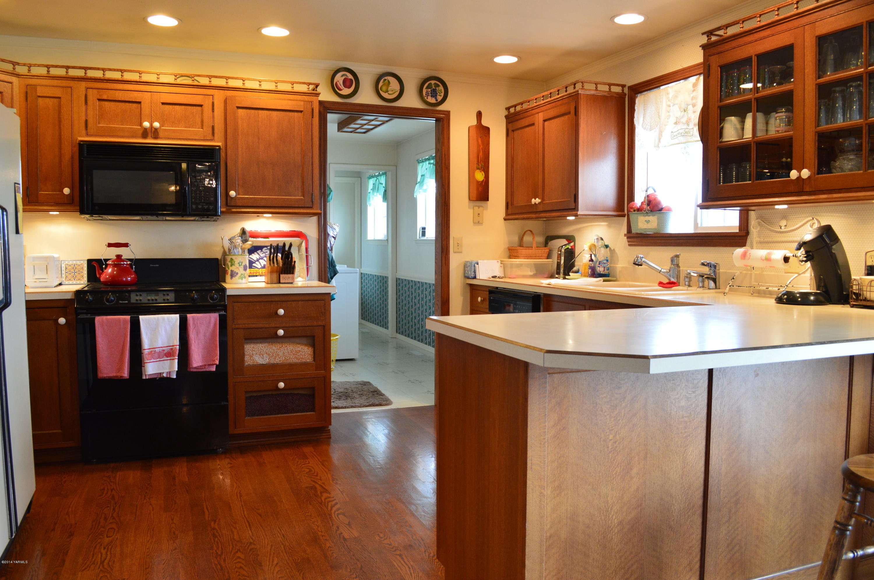 1051 Hubbard Road Yakima, WA 98903 - Photo 9 of 50 a kitchen with stainless steel appliances a sink a stove and a refrigerator