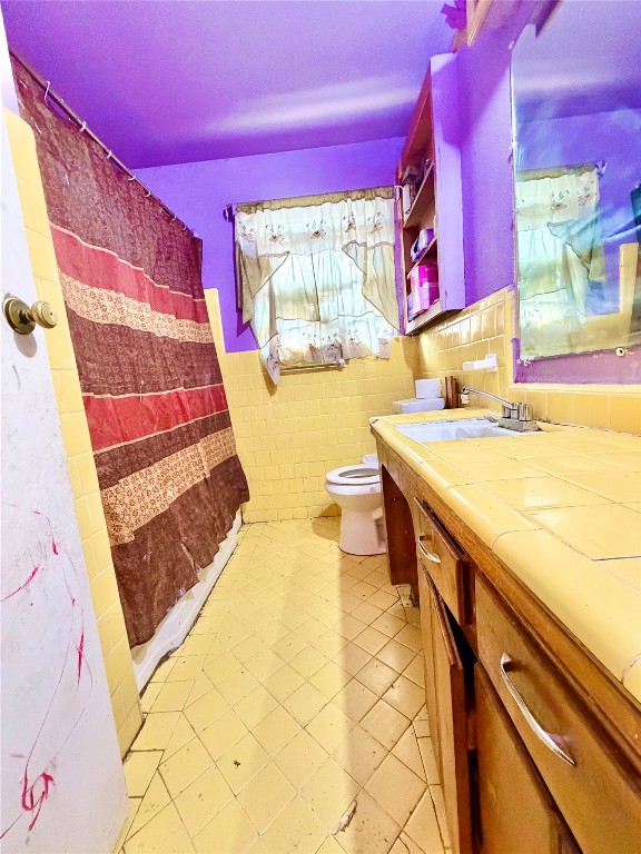 315 Gober Street Houston, TX 77017 - Photo 12 of 12 a bathroom with a sink a bathtub and a shower