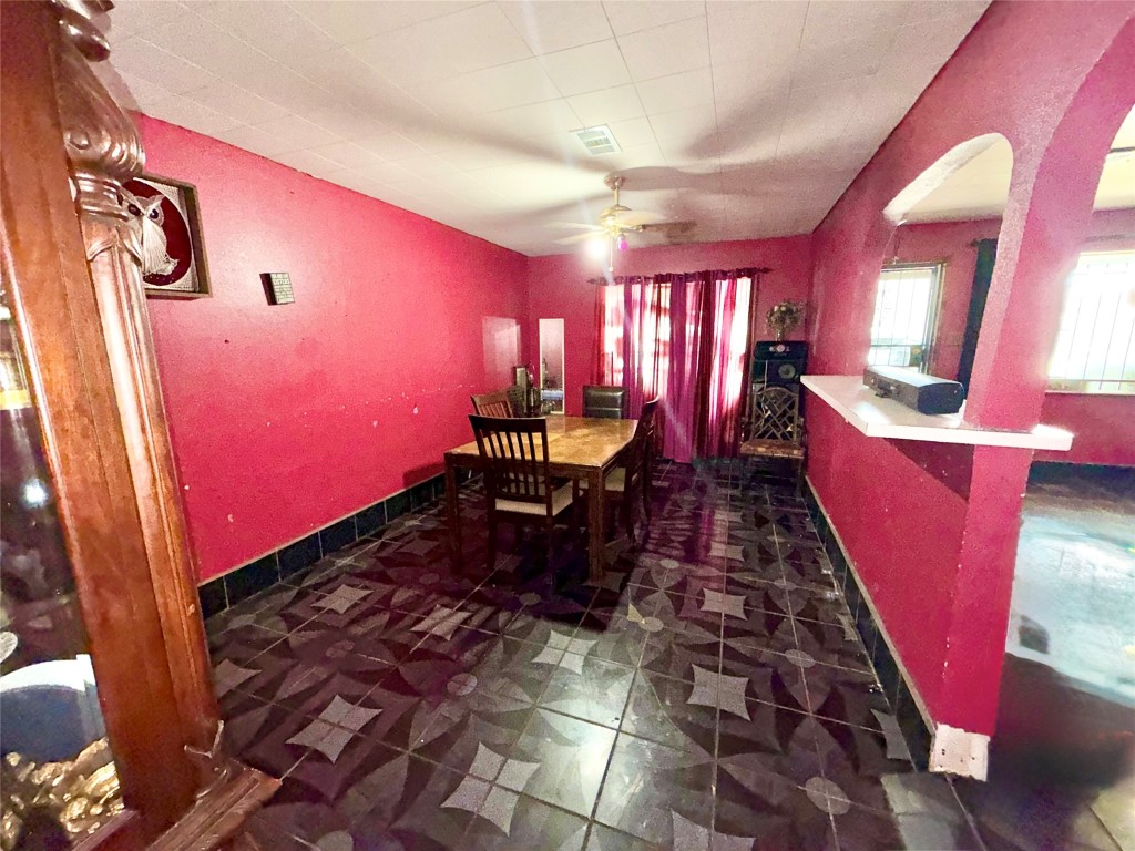 315 Gober Street Houston, TX 77017 - Photo 4 of 12 a large room with lots of chairs and a chandelier