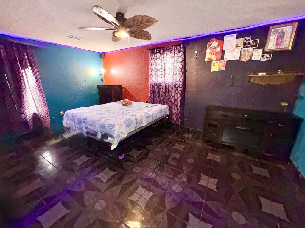 315 Gober Street Houston, TX 77017 - Photo 7 of 12 a bedroom with a bed and a mirror