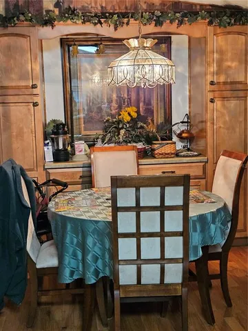 a kitchen with stainless steel appliances granite countertop a sink a stove and cabinets