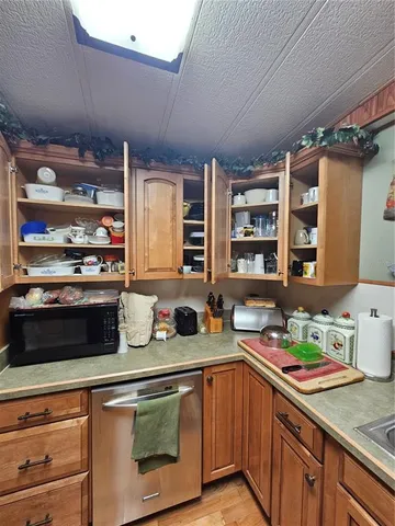 a living room with lots of furniture and a wooden floor