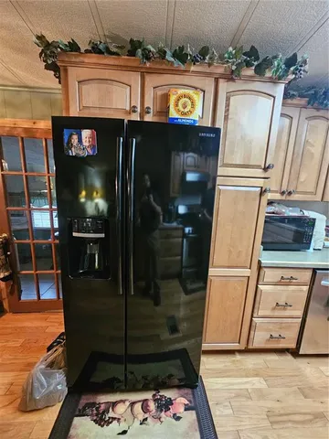 a spacious bedroom with a bed and a chandelier